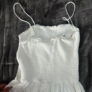 Beautiful white beach jumpsuit with wide leg flare light color bottoms